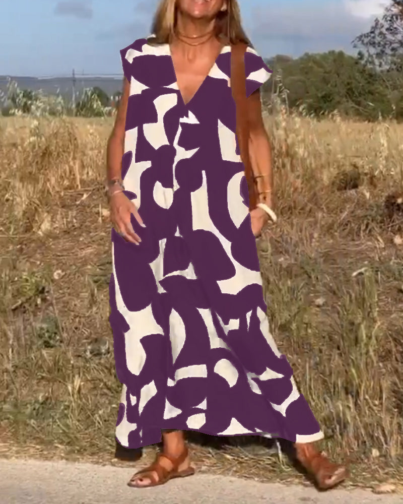 ELVIRA – Gedrukte V-hals jurk met elegante snit en zomerse flair