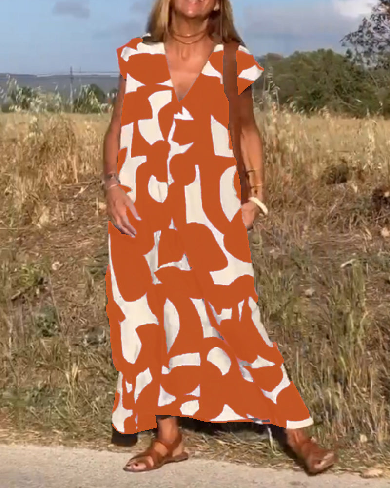 ELVIRA – Gedrukte V-hals jurk met elegante snit en zomerse flair