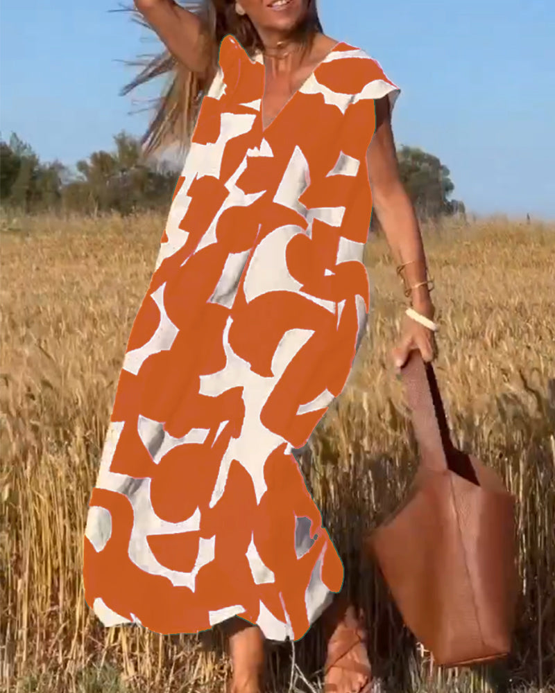 ELVIRA – Gedrukte V-hals jurk met elegante snit en zomerse flair