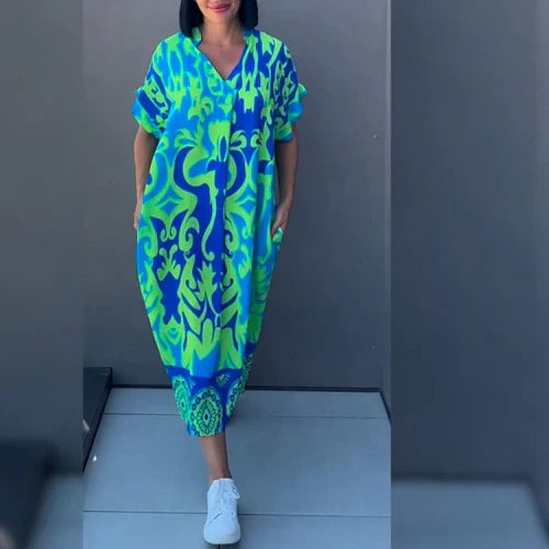 Vloeiende bloemenjurk met romantische flair – ELENA