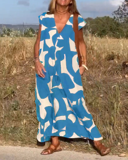 ELVIRA – Gedrukte V-hals jurk met elegante snit en zomerse flair