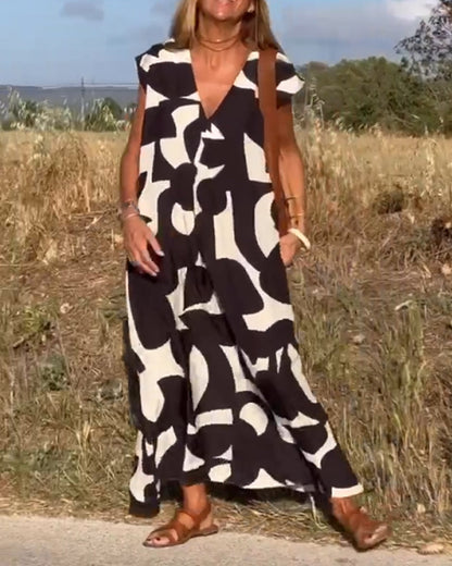ELVIRA – Gedrukte V-hals jurk met elegante snit en zomerse flair
