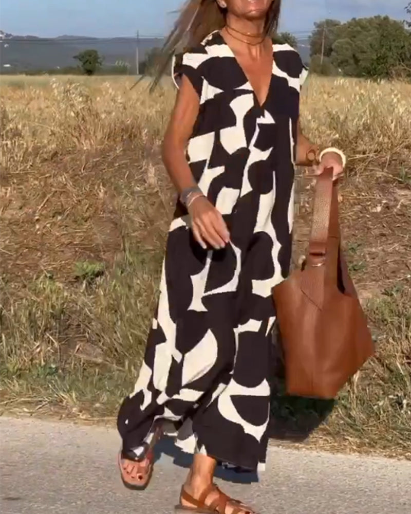 ELVIRA – Gedrukte V-hals jurk met elegante snit en zomerse flair
