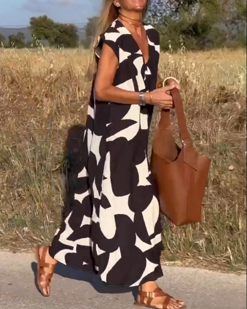 ELVIRA – Gedrukte V-hals jurk met elegante snit en zomerse flair