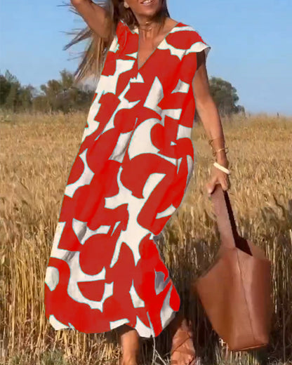 ELVIRA – Gedrukte V-hals jurk met elegante snit en zomerse flair