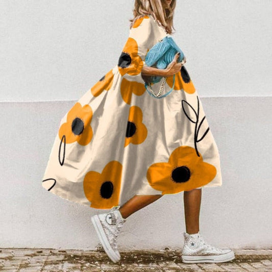Wijde dames midi-jurk met ballonmouwen en elegante flair – CÉLINA BREEZE - Glamorix
