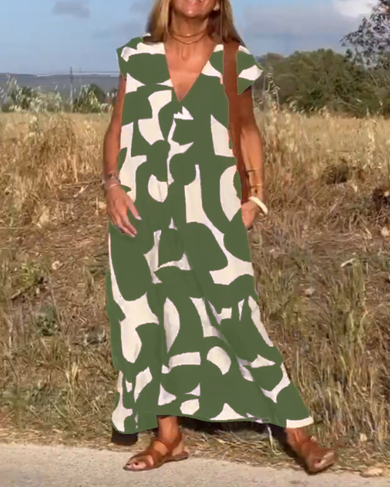 ELVIRA – Gedrukte V-hals jurk met elegante snit en zomerse flair