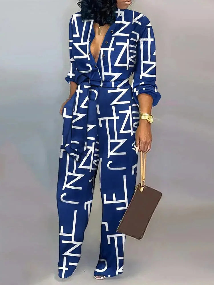 Elegante wijde damesjumpsuit met diepe V-hals en strikceintuur – SENA FLOW - Glamorix