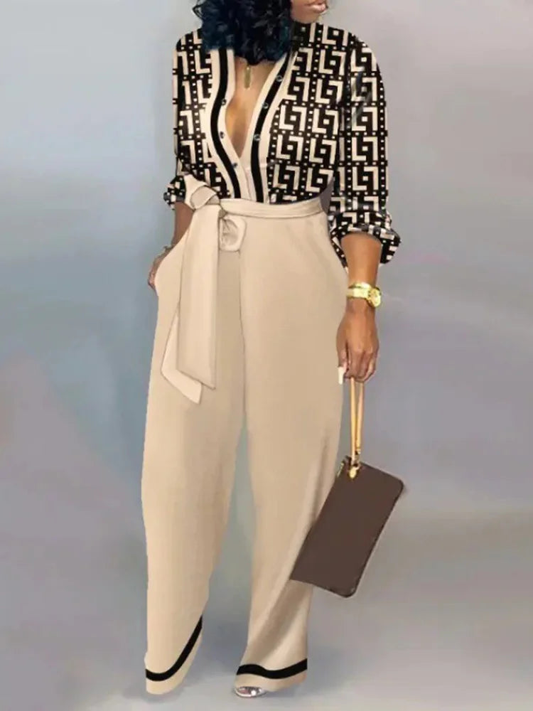 Elegante wijde damesjumpsuit met diepe V-hals en strikceintuur – SENA FLOW - Glamorix