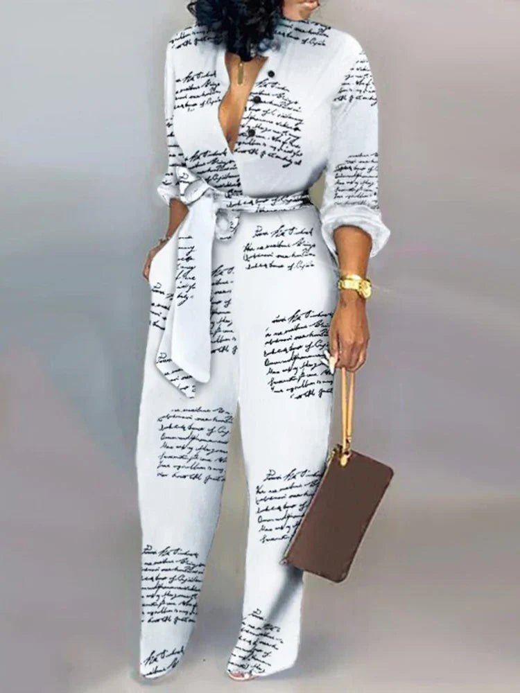 Elegante wijde damesjumpsuit met diepe V-hals en strikceintuur – SENA FLOW - Glamorix