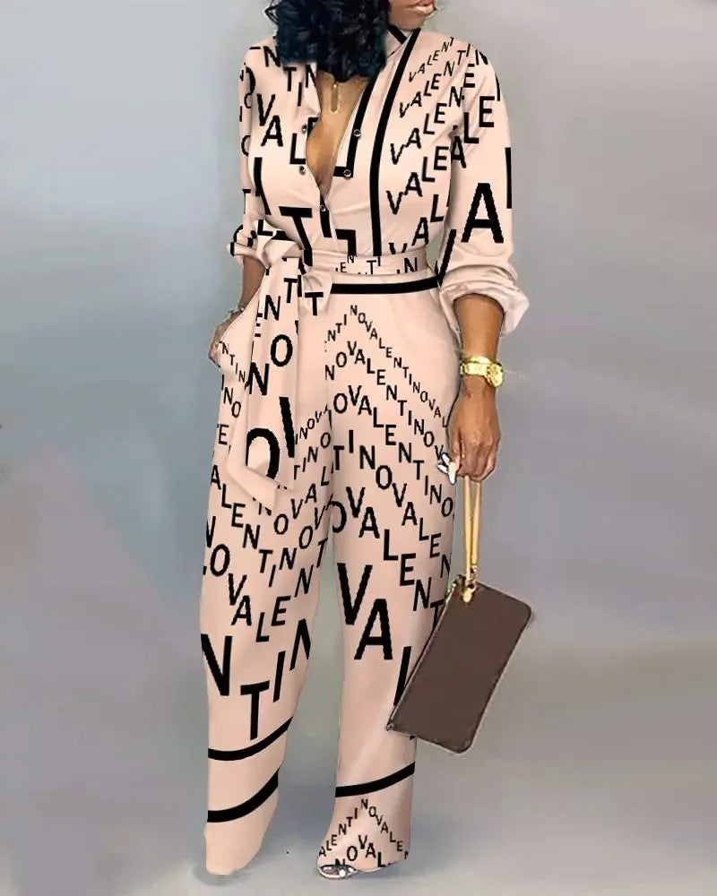 Elegante wijde damesjumpsuit met diepe V-hals en strikceintuur – SENA FLOW - Glamorix