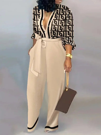 Elegante wijde damesjumpsuit met diepe V-hals en strikceintuur – SENA FLOW - Glamorix