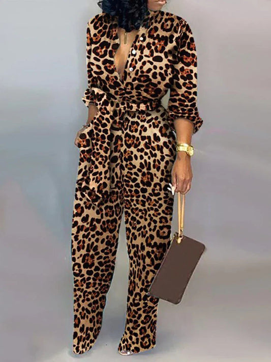 Elegante wijde damesjumpsuit met diepe V-hals en strikceintuur – SENA FLOW - Glamorix