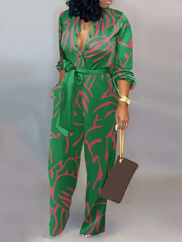 Elegante wijde damesjumpsuit met diepe V-hals en strikceintuur – SENA FLOW - Glamorix